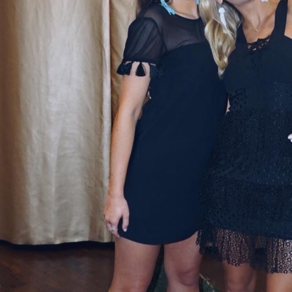 Mesh black dress with tassels in sleeves